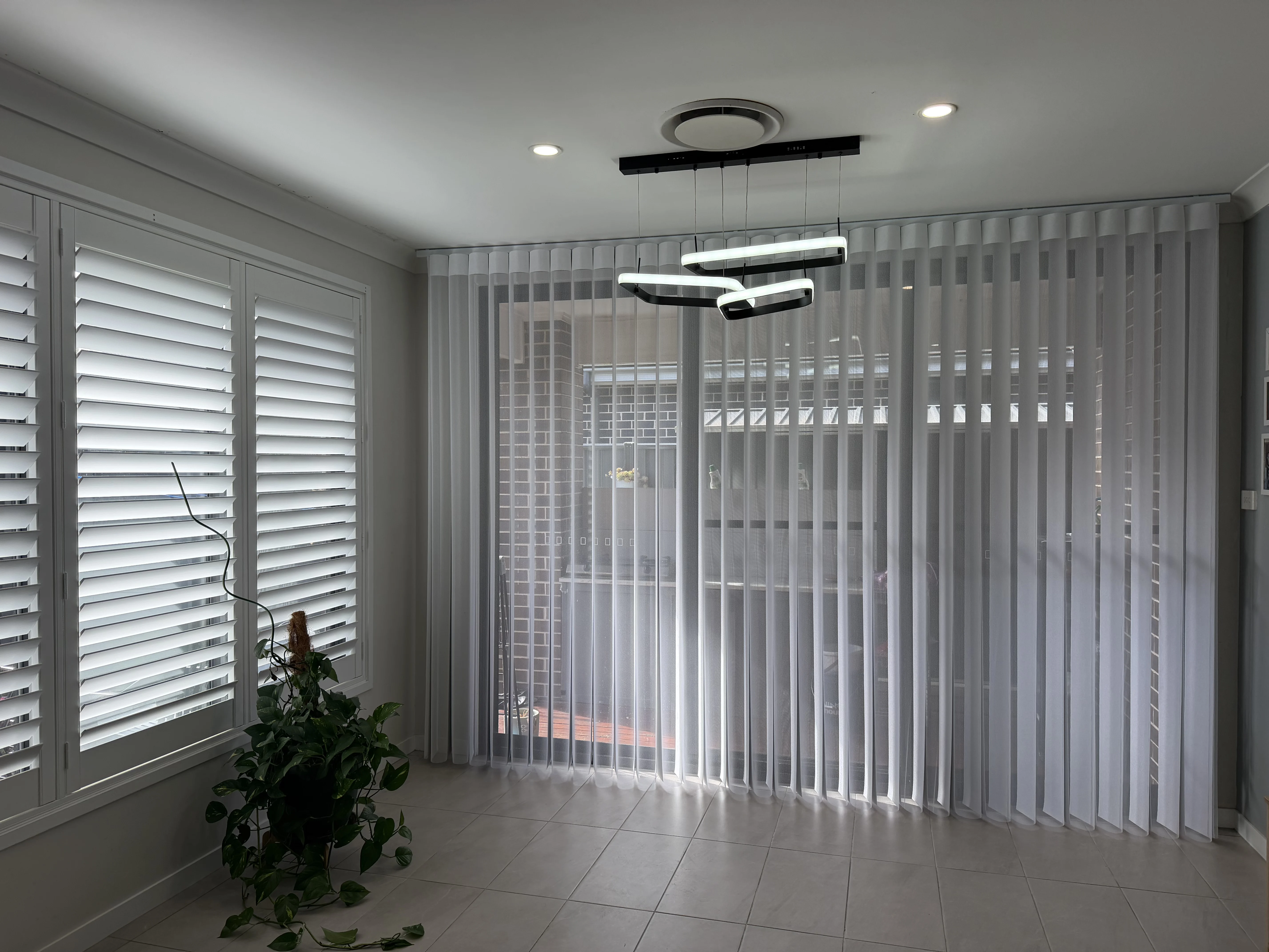 Sheer curtains installed in a Sydney living room
